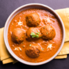 Mughlai Malai Kofta curry with creamy white gravy and soft koftas